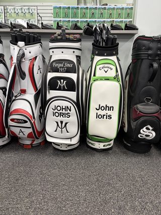 Custom golf bags on display in the shop